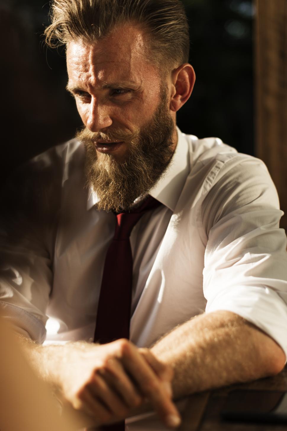 Free Image of A bearded Caucasian man wearing red necktie 