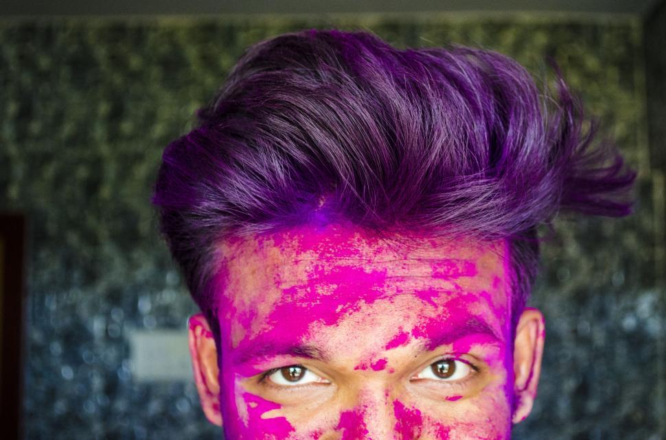 Free Image of Pink Holi Color on Face 