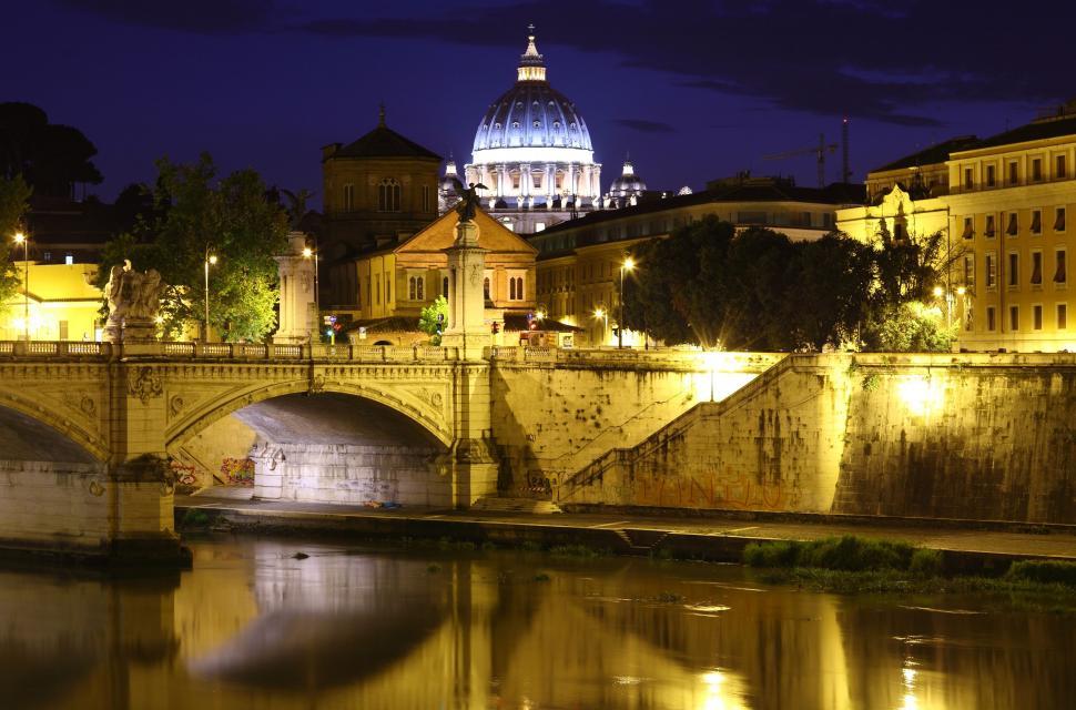 Free Image of St Peter Basilica and St Angelo Bridge With Yellow Night Lights  