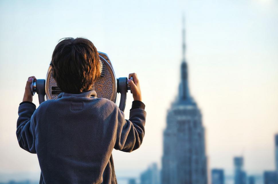 Free Image of Boy with coin operated binoculars 