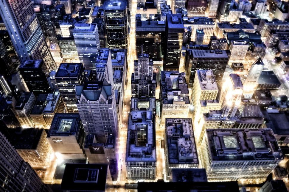 Free Image of Blue and Yellow Lights of Skyscrapers From Above 