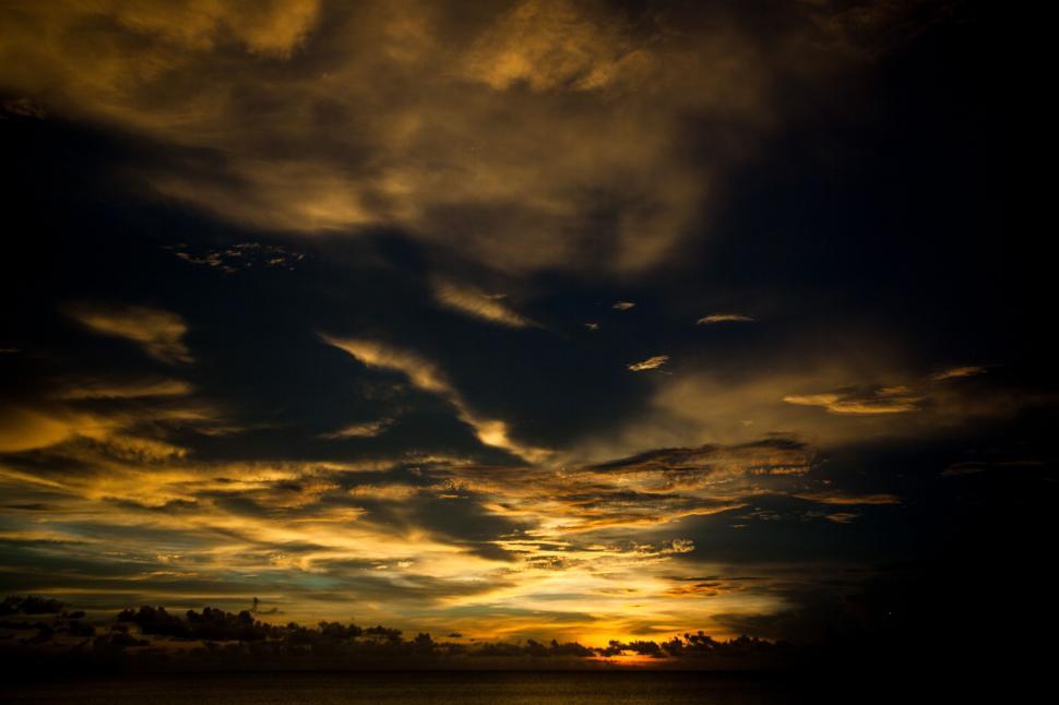Free Image of Black and Yellow Sunset Clouds  