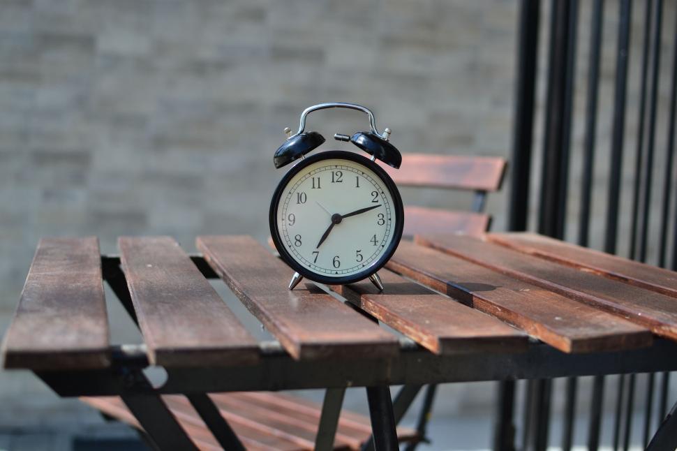 Free Image of Outdoor view of Alarm Clock on table  