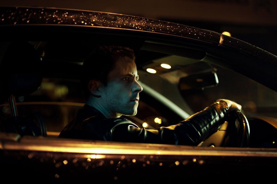 Free Image of Night View of Man in Car  