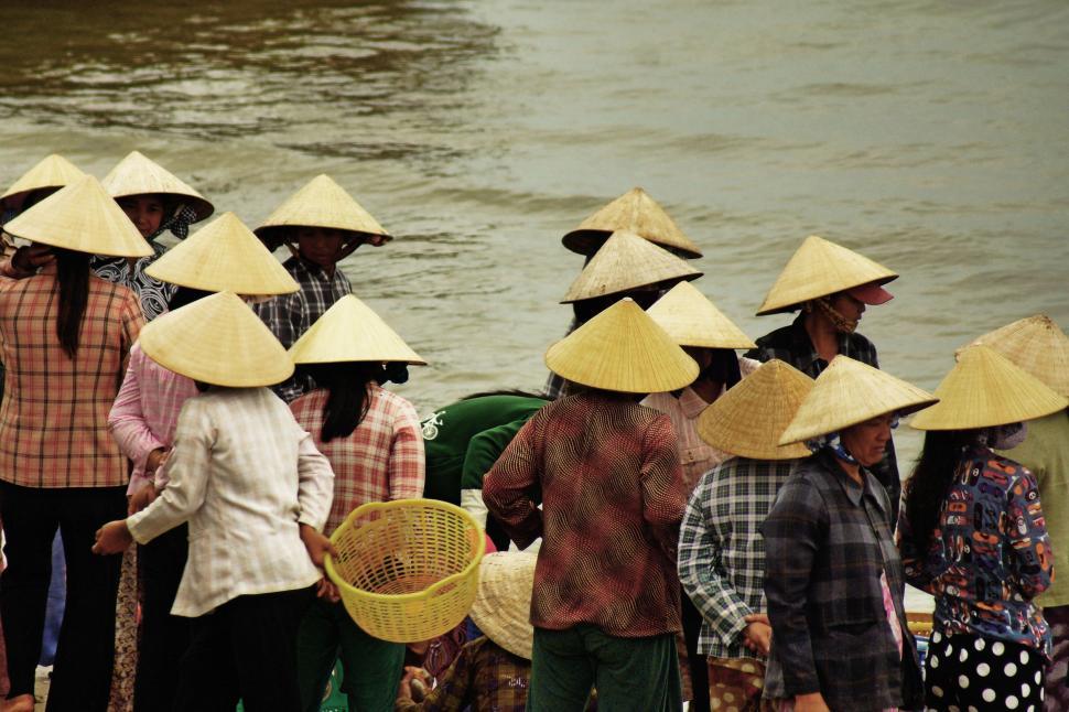 Free Image of People in rice hats 