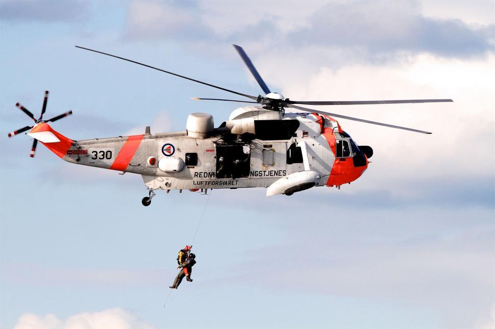 Free Image of Air-force plane rescue operation with rope 