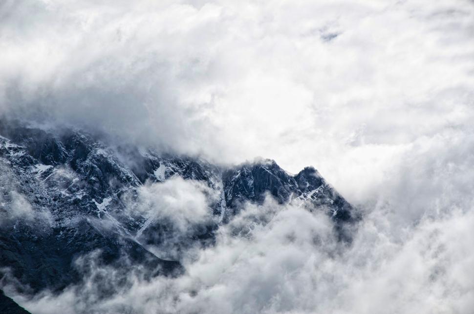 Free Image of White Clouds and Mountain  
