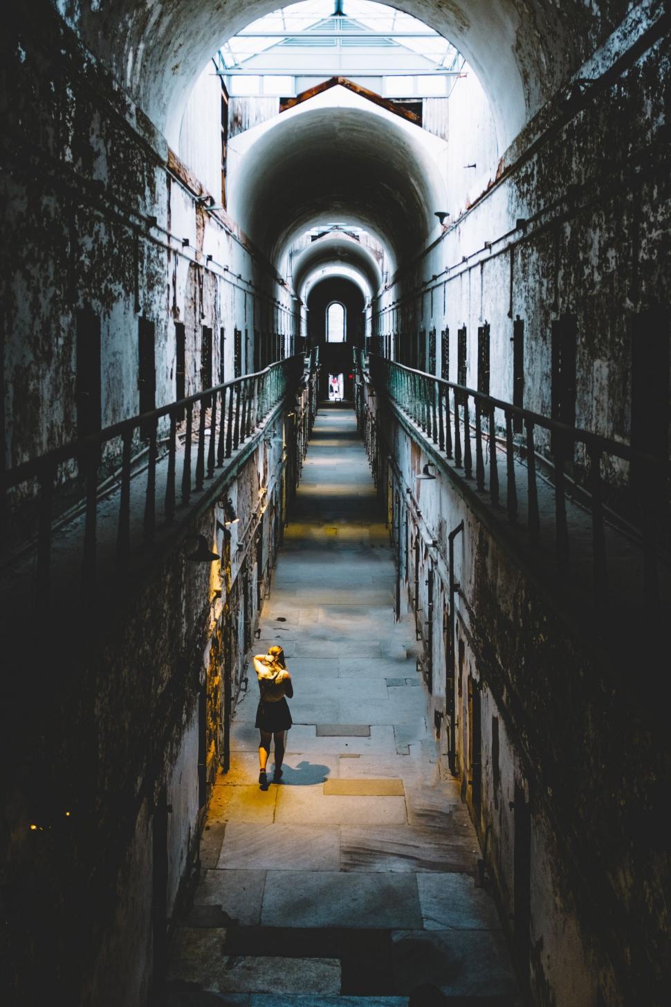 Free Image of Old Alleyway tunnel with night lights  