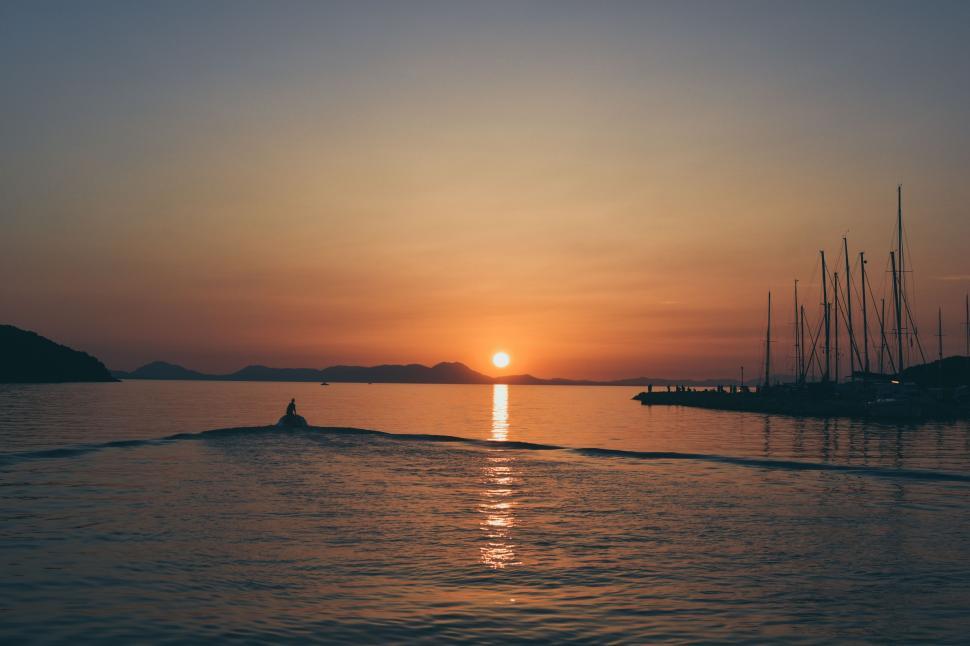 Free Image of Boat in Ocean with Sunset  