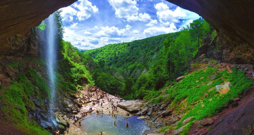 Free Image of People bathing in waterfall  
