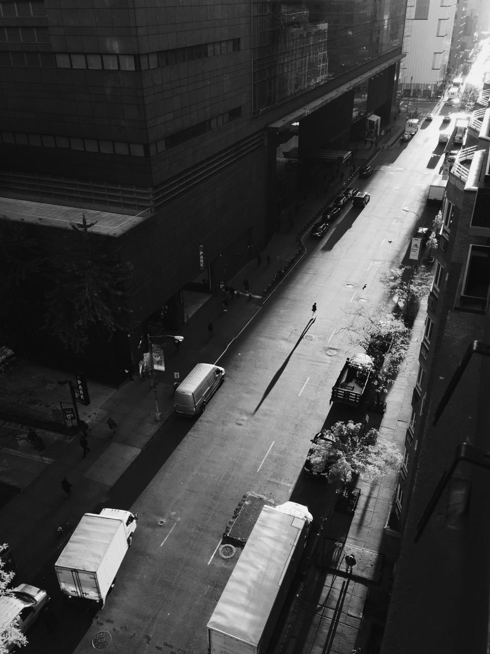 Free Image of City Road with one person walking with shadow - Monochrome 