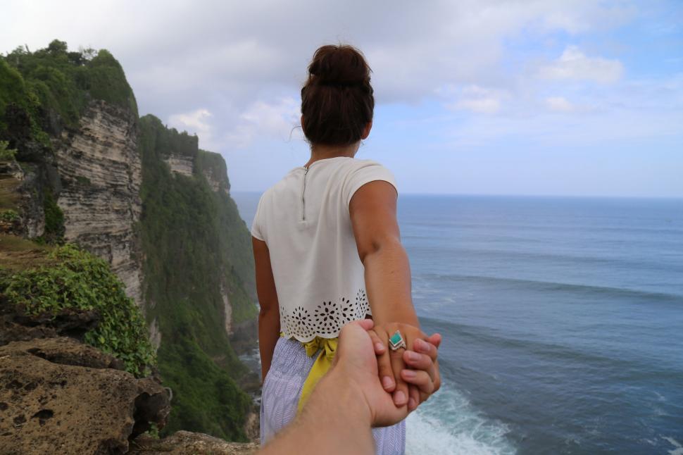 Free Image of Couple Holding Hands  