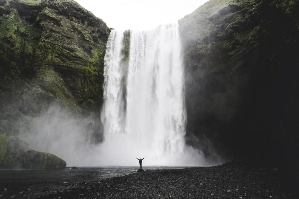Free Image of Man Standing near waterfall  