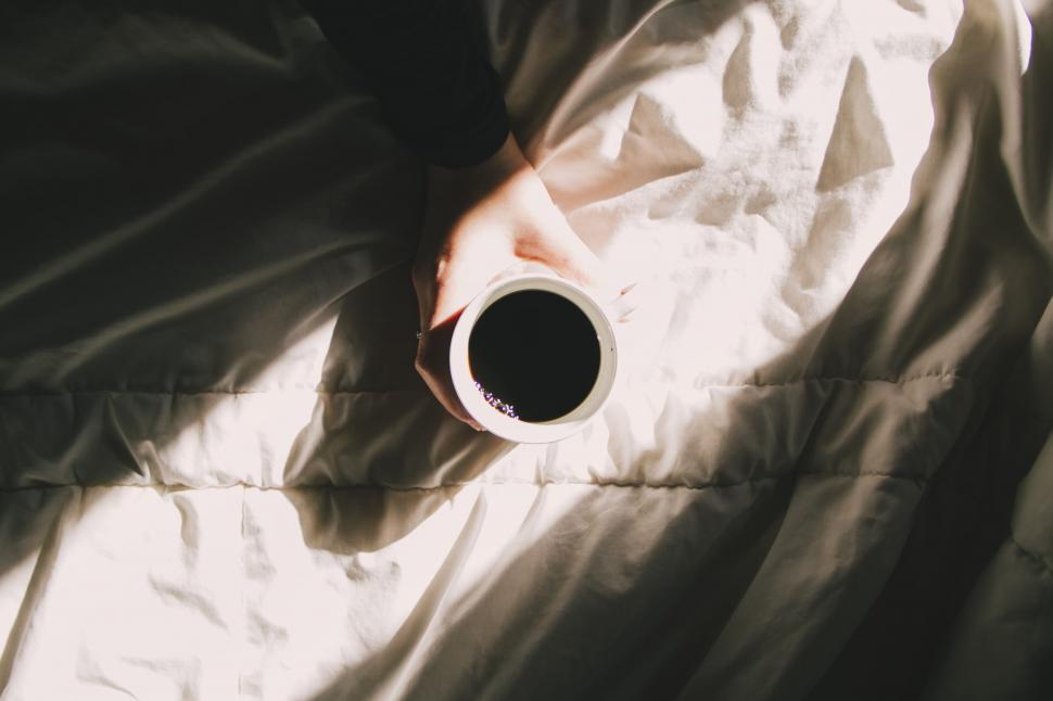 Free Image of Coffee on Bed with sunlight  