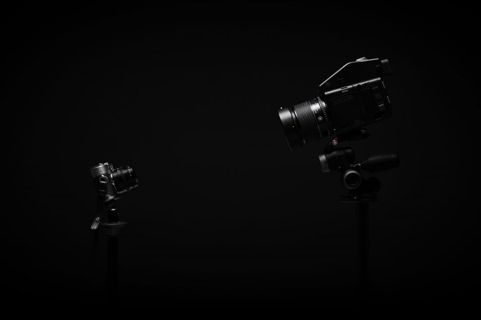 Free Image of Camera and lens in black background 