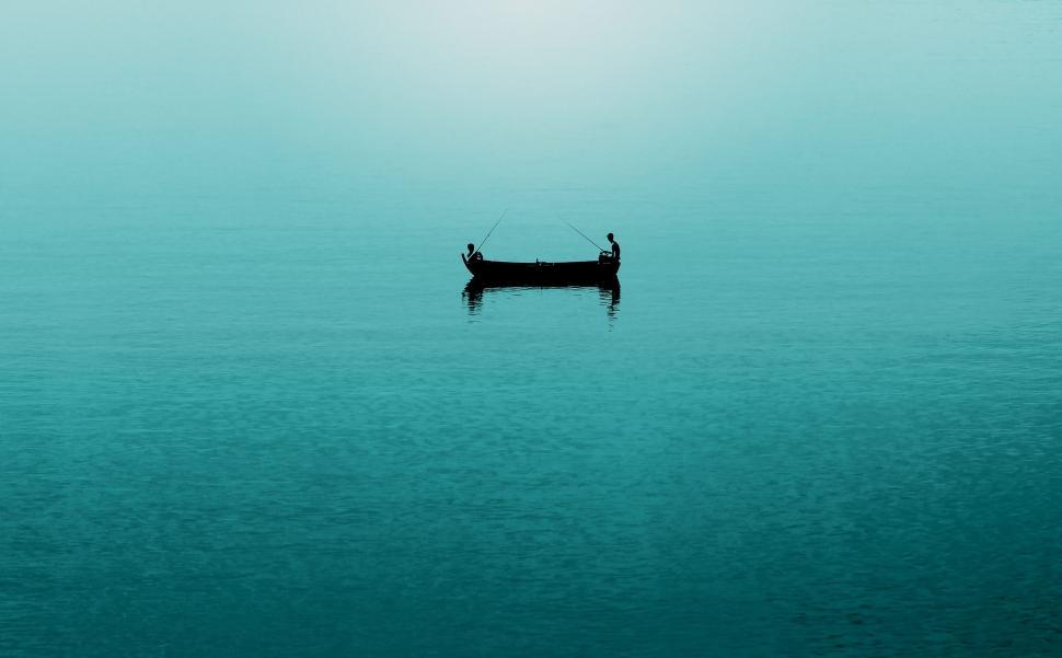 Free Image of Silhouette of Fisherman Boat in Ocean 