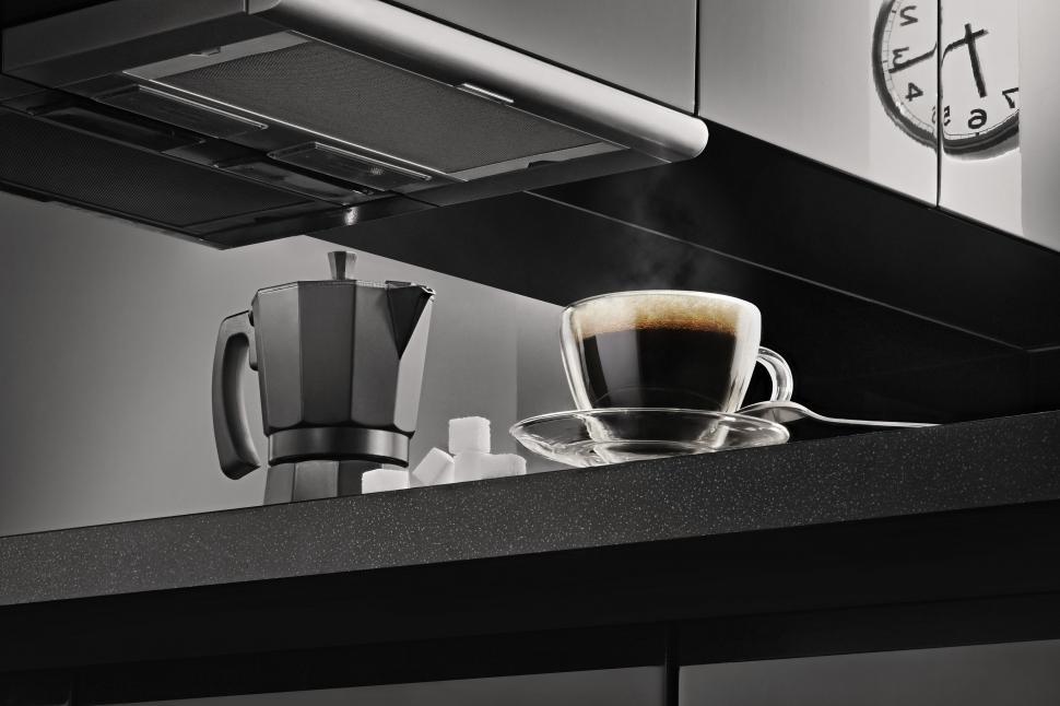 Free Image of Coffee Maker and Coffee with reflection of wall clock 