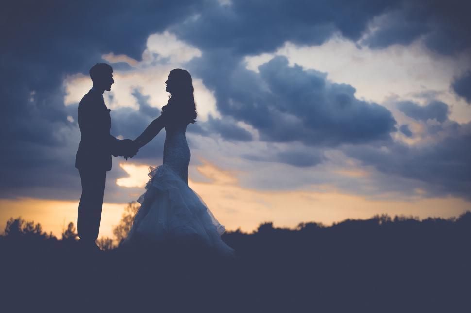 Free Image of Couple holding each other hands  