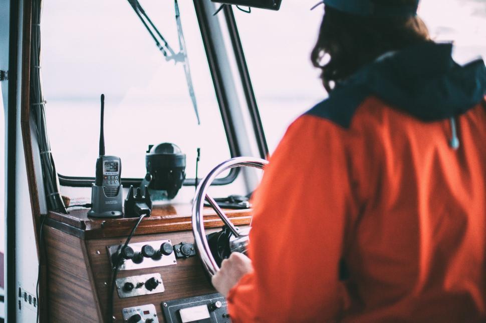 Free Image of Yacht Captain with steering wheel  