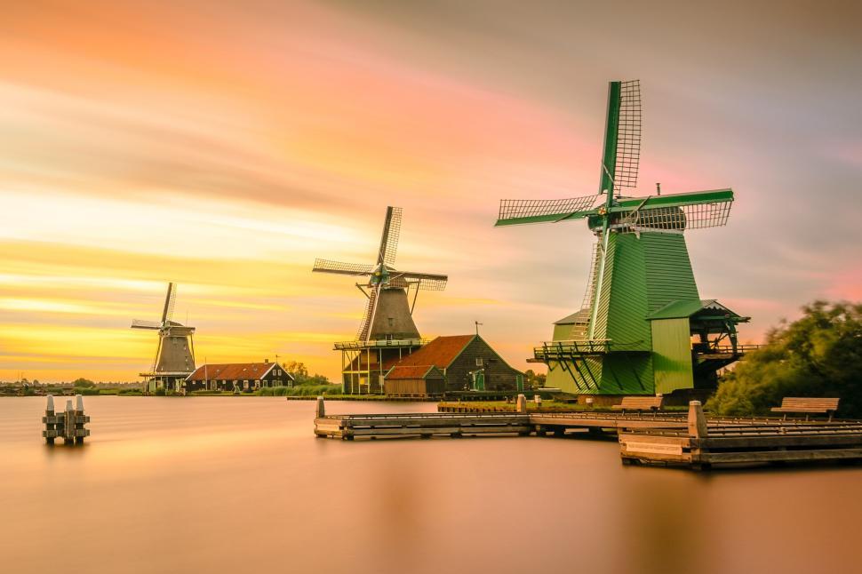 Free Image of Windmills on river 