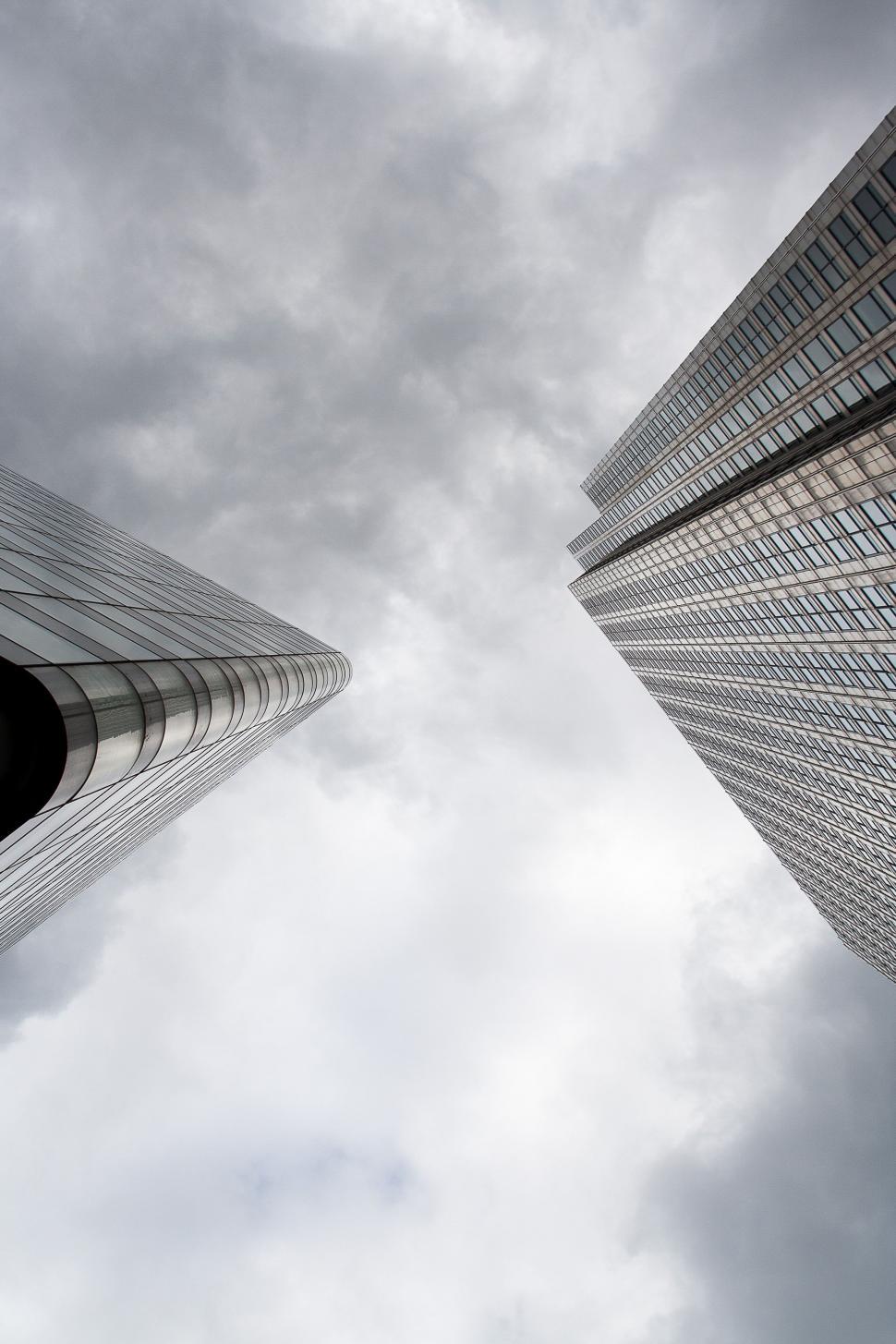 Free Image of Buildings and clouds from below 