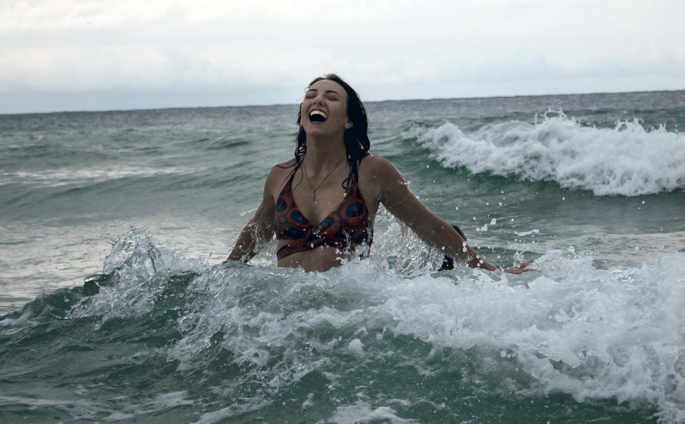 Free Image of Woman enjoying beach water  