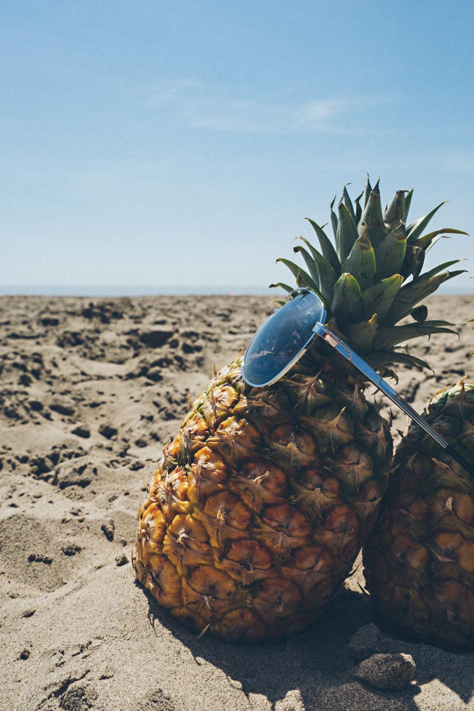 Free Image of Pineapple and sunglasses  