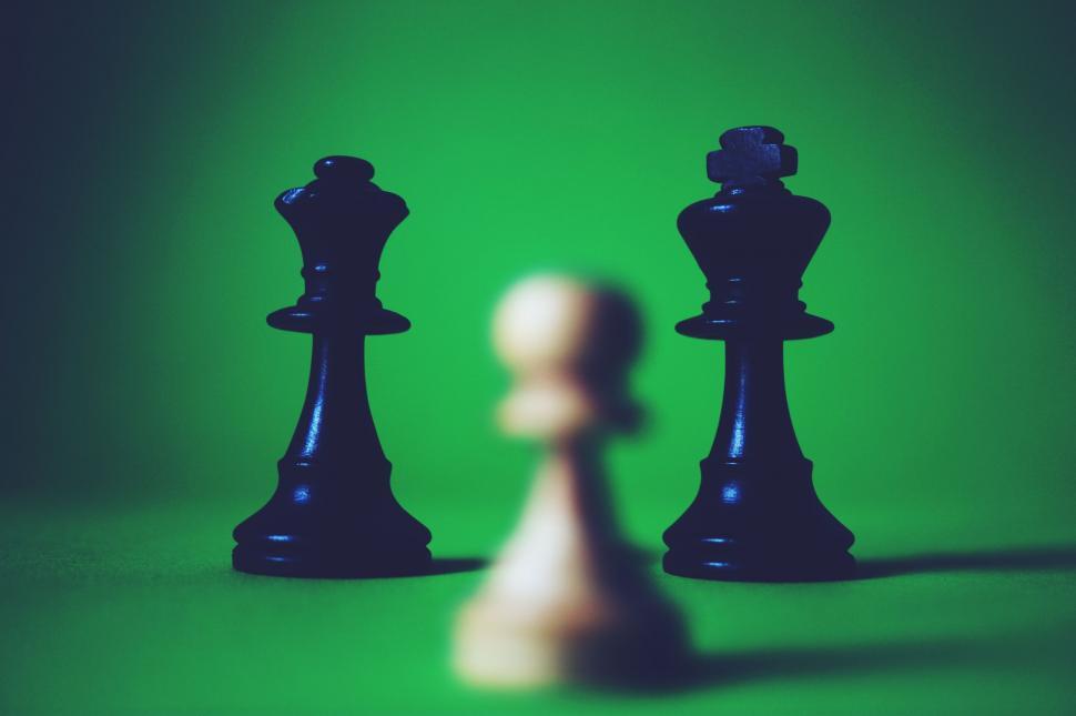 Free Image of Chess pieces on green background  