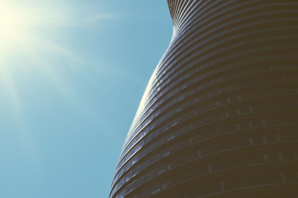 Free Image of Curved Building and Sun Flare 