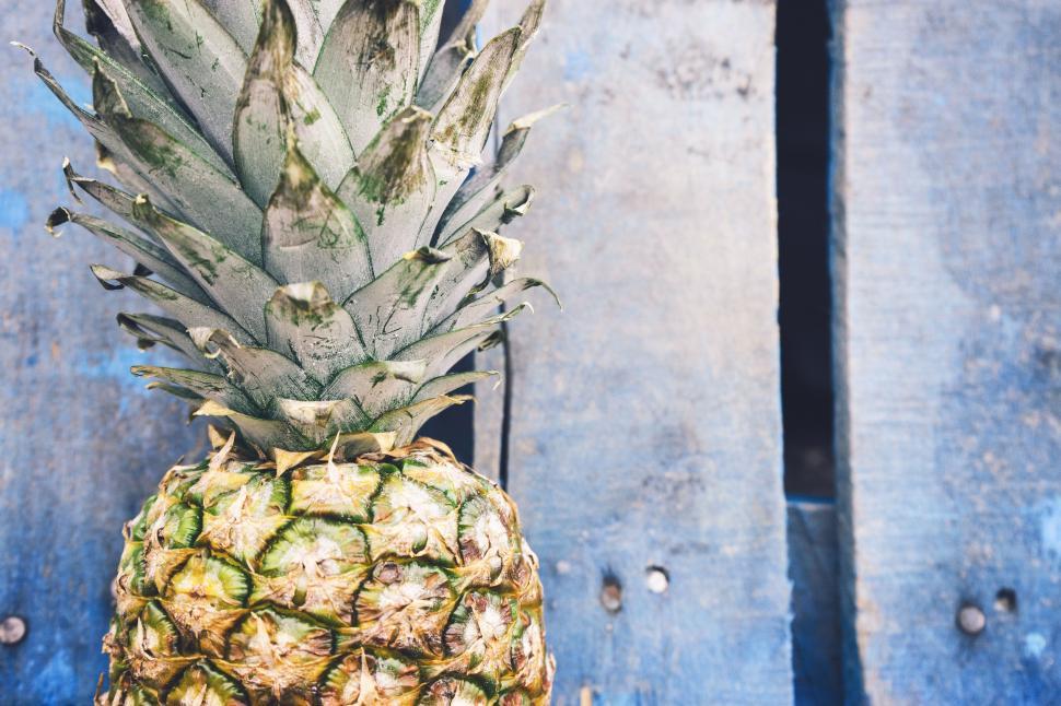 Free Image of Pineapple and wooden planks  