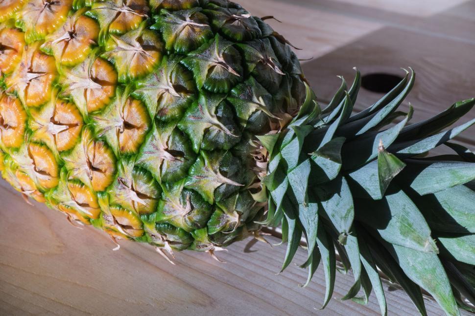Free Image of Pineapple on wooden table  
