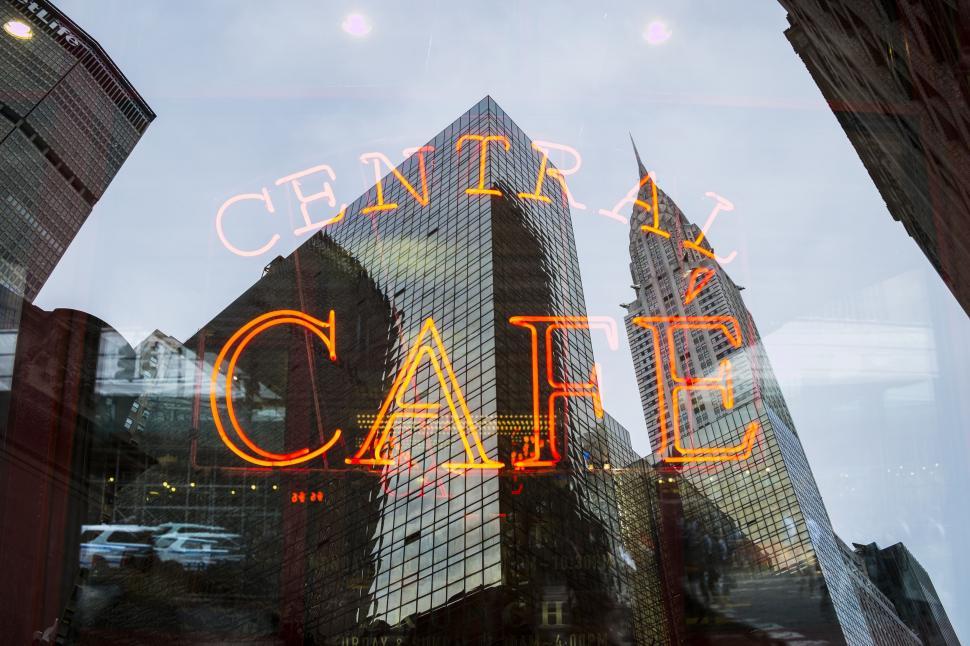 Free Image of Central Cafe Neon Lights with Skyscrapers 