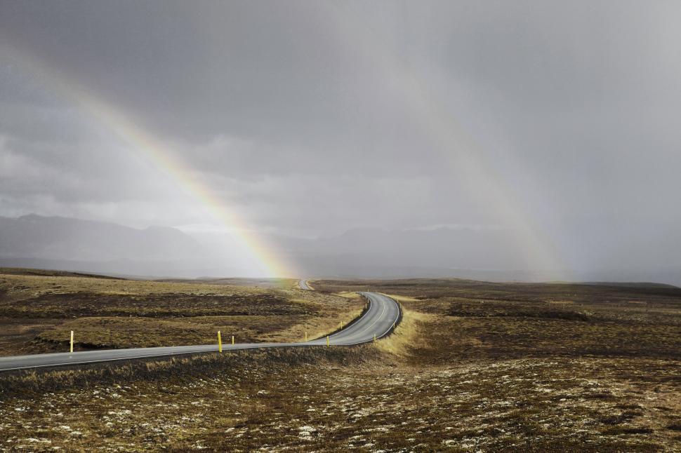 Free Image of Rainbows over empty road  