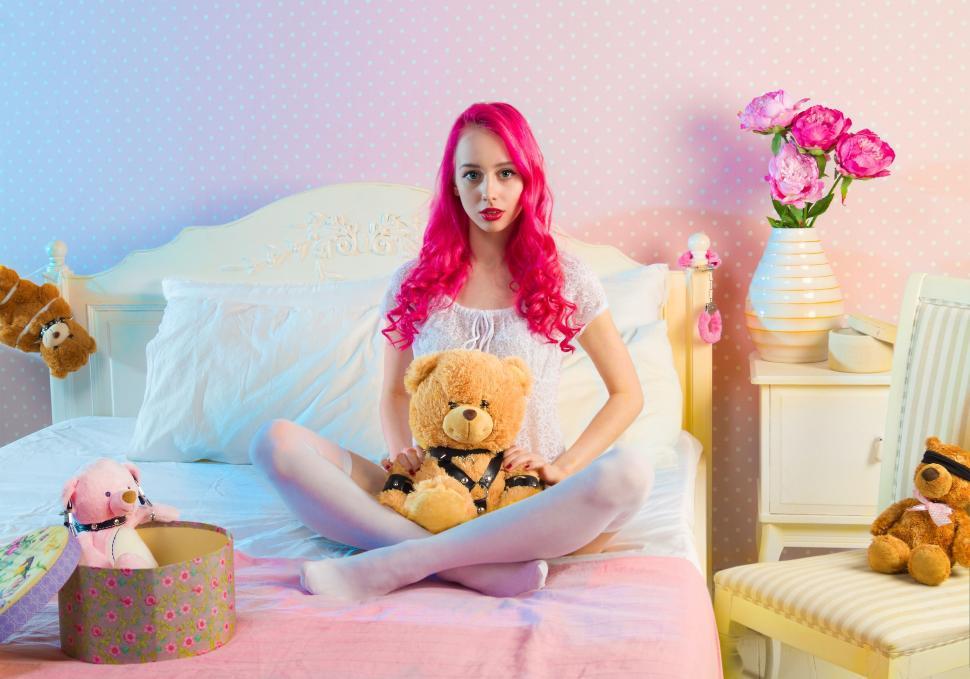 Free Image of Pink Hair Woman with Teddy Bear  