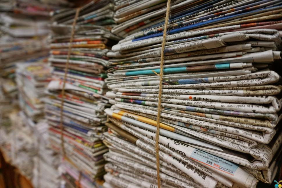 Download Free Stock Photo of Bundles of old newspapers 