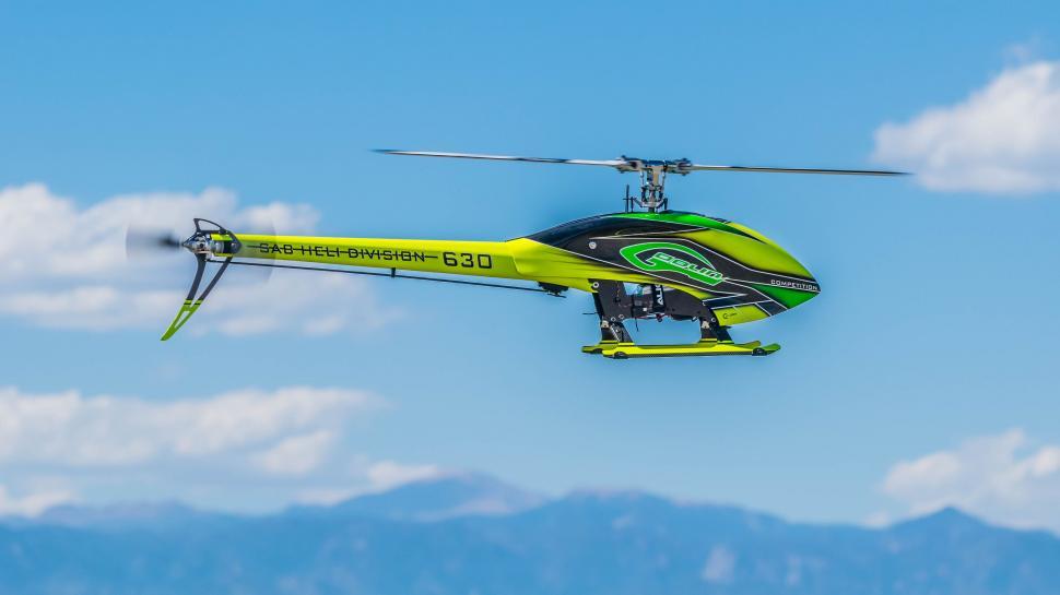 Free Image of Remote controlled Helicopter Toy in sky  