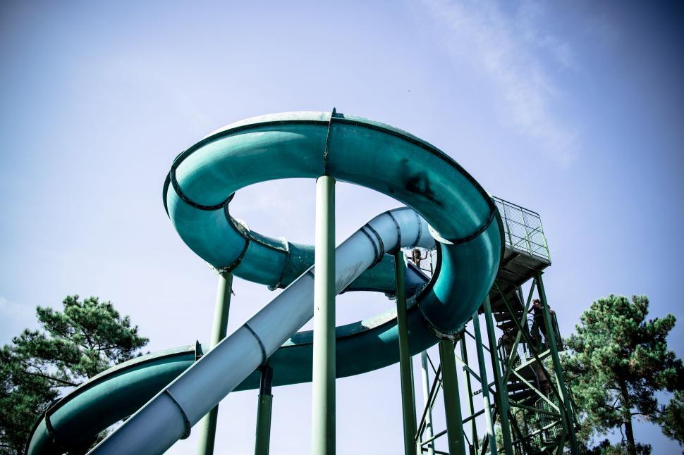 Free Image of Tube Slides and Trees at amusement park 
