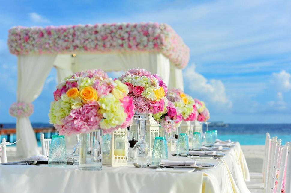 Free Image of Beach Wedding Set up - Flowers on Dining Table 