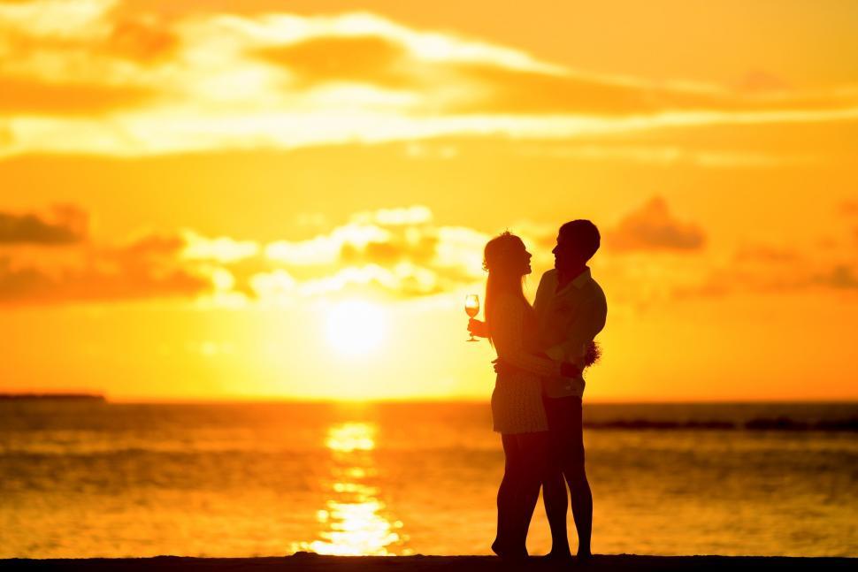 Free Image of Couple and Yellow Sunset Sky  