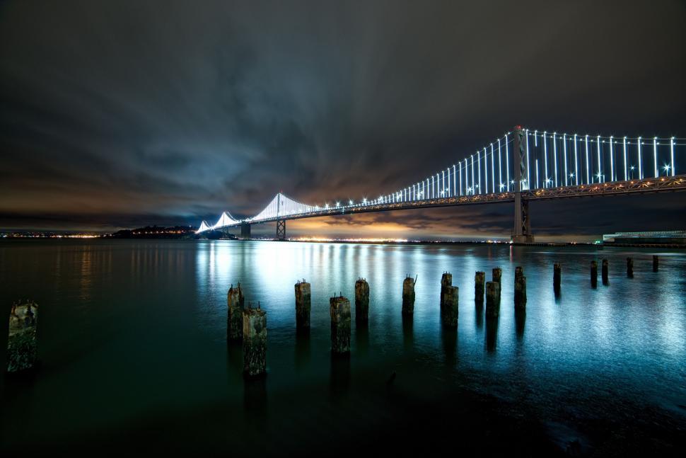 Free Image of Night Lights of Bridge Over Ocean 