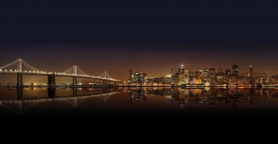 Free Image of Night view of Oakland Bay Bridge with skyscrapers  