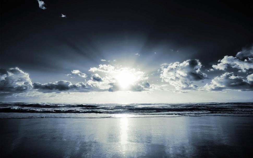 Free Image of Black Clouds and Sunbeam over Ocean  