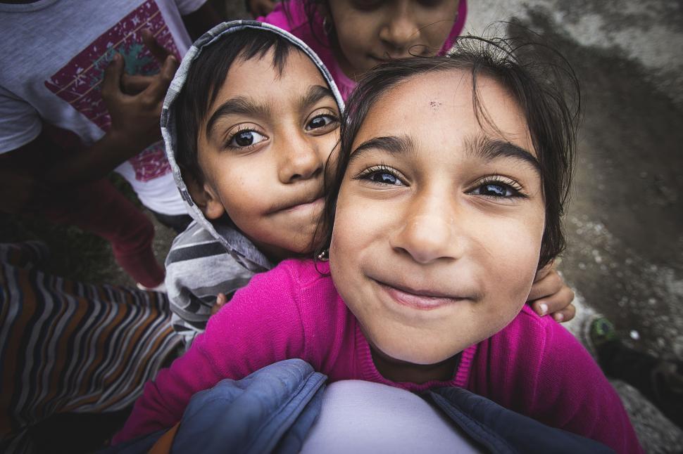 Free Image of Children looking up to the camera  