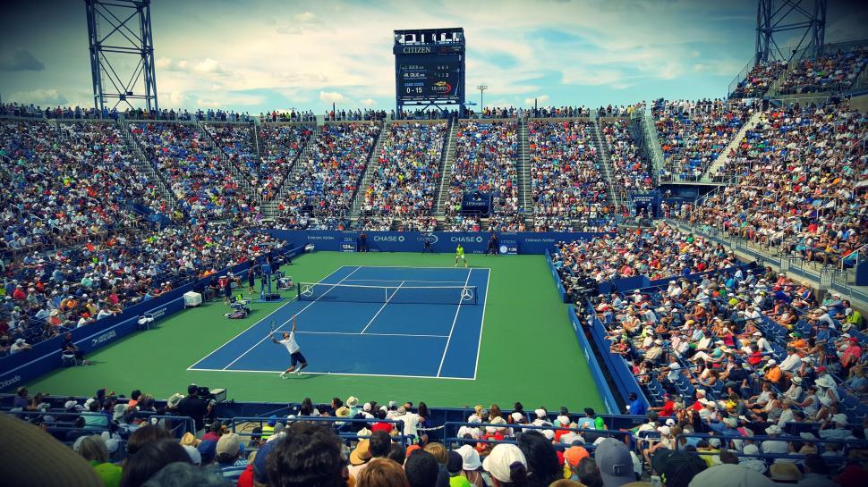 Free Image of Tennis stadium with crowd and players 