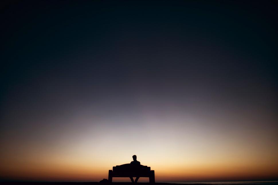 Free Image of Silhouette of man on bench - copy space  