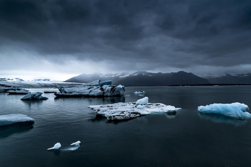 Download Free Stock Photo of Glacier and iceberg with dark clouds  