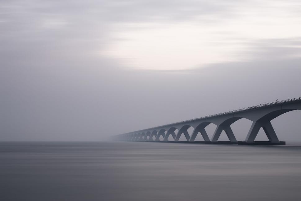 Free Image of Concrete Bridge over Ocean  