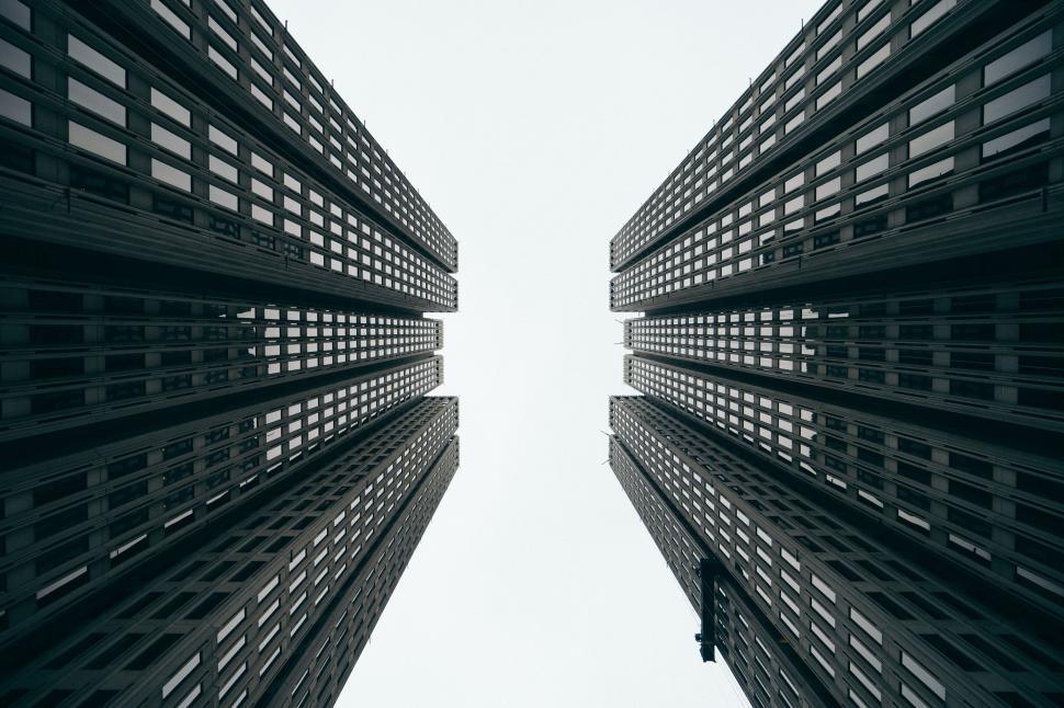 Free Image of Two high rise building from below  