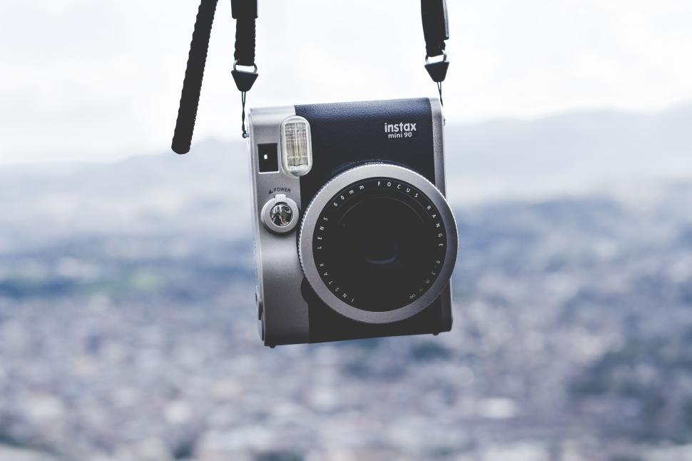 Free Image of Hanging Instax camera 