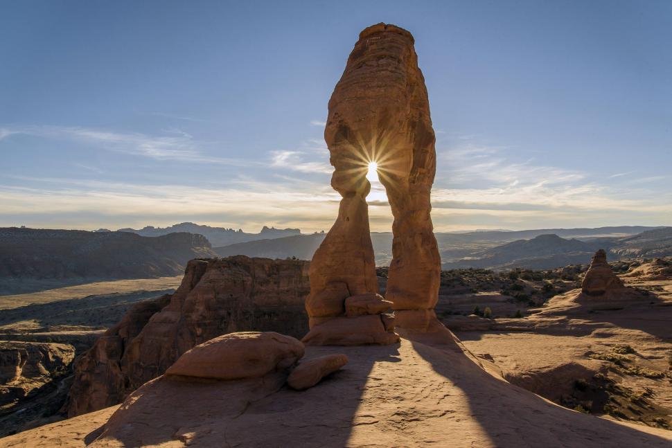Free Image of Delicate Arch with lens flare  